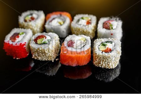 Rainbow Sushi Roll With Salmon, Eel, Tuna, Avocado, Royal Prawn, Cream Cheese Philadelphi. Sushi Men