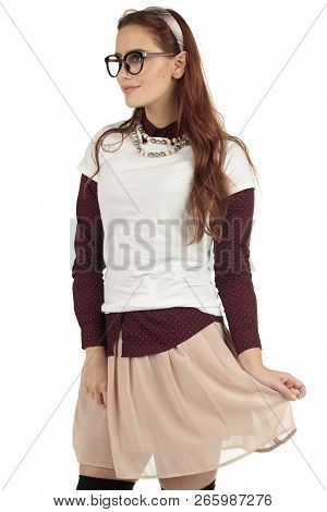 Day Dreaming Preppy Girl Look Into The Distance With A Pink Skirt And White T-shirt