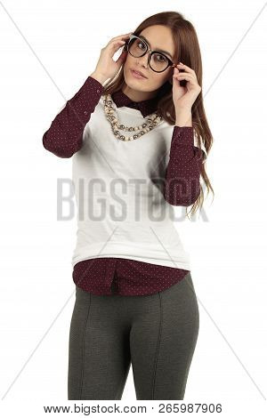 Cute Smiling Preppy, Fashion Geek Girl In A White T-shirt And Maroon Blouse