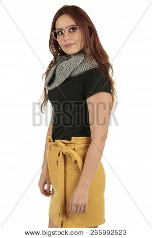 Cute Smiling Preppy, Fashion Geek Girl In A Black T-shirt And Yellow Skirt