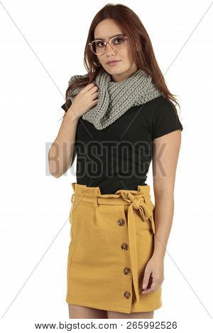 Cute Smiling Preppy, Fashion Geek Girl In A Black T-shirt And Yellow Skirt