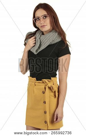 Cute Smiling Preppy, Fashion Geek Girl In A Black T-shirt And Yellow Skirt