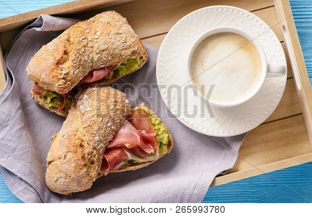 Sandwiches With Ham And Avocade Spread, On Wooden Tray.