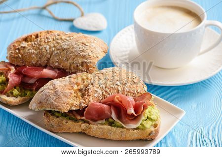 Sandwiches With Ham And Avocade Spread, On Wooden Tray.