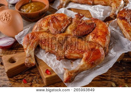Gentle Baked Chicken On A Wooden Background.