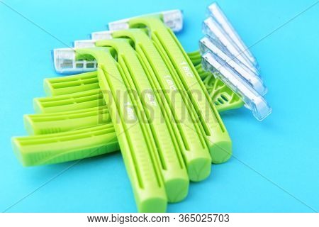 Warszawa, Poland January 17 2020:bic Plastic Disposable Razors.green Plastic Disposable Razor On A B