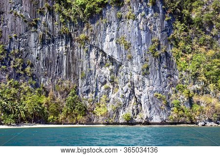 Huge Karst Mountains Overgrown With Shrubs On A Desert Island In The Indian Ocean, Palawan. Philippi