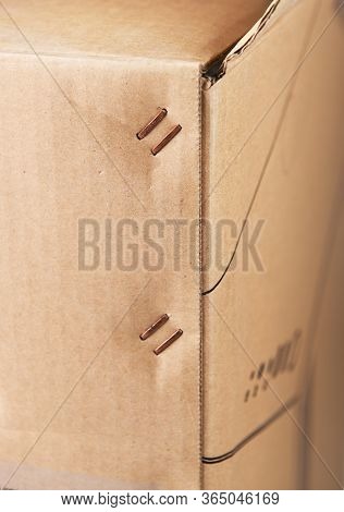 Metal Staples On The Corner Of A Cardboard Box.box Staplers Ensure Fast And Secure Lid Closing.a Clo