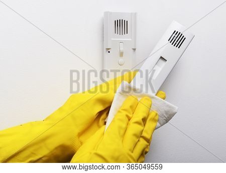 Disinfection In Public Places, The Fight Against The Virus, Coronavirus. The Working Hand Wipes The 