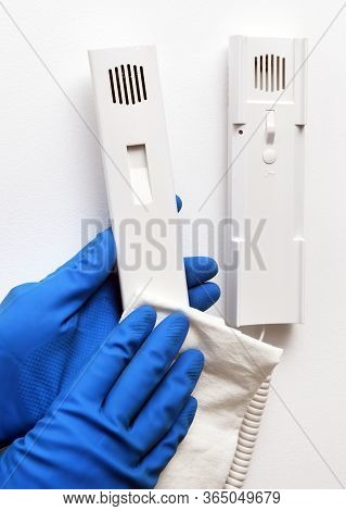 Disinfection In Public Places, The Fight Against The Virus, Coronavirus. The Working Hand Wipes The 
