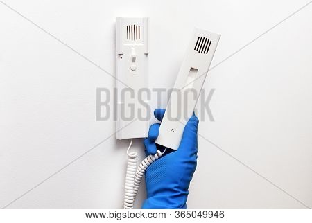Disinfection In Public Places, The Fight Against The Virus, Coronavirus. The Working Hand Wipes The 