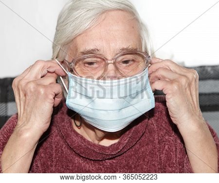 Elderly Woman In A Medical Mask