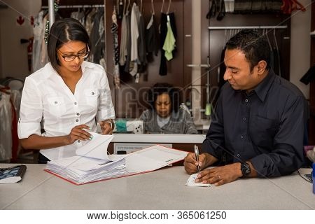 Johannesburg, South Africa - May 25, 2015: Small Business Owners Of Local Dry Cleaning Franchise Rev