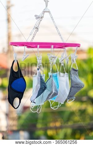 Wash The Face Mask And Dry In The Air. Handmade Own Masks To Protect From Dust Pollution And Virus E