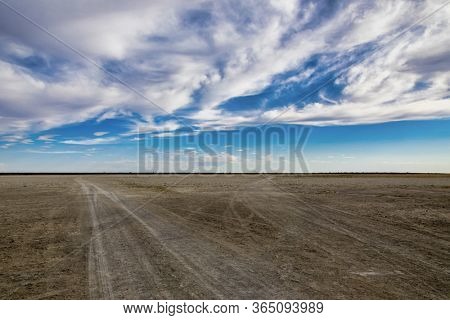 Makgadikgadi pans in Botswana, plain ground and the horizon with the blue sky