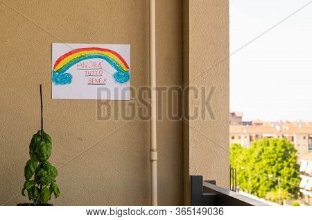 Turin, Piedmont, Italy. Coronavirus Pandemic. On The Balcony Wall The Drawing With The Rainbow With