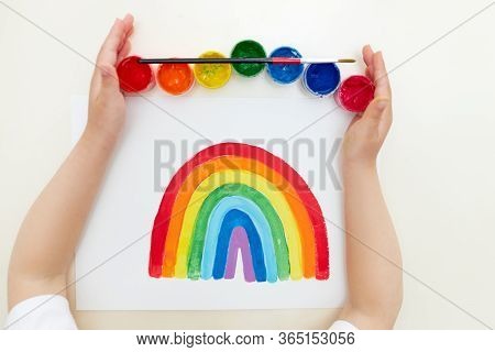 Thank To Nhs. Kid Painting The Rainbow During Covid-19 Quarantine At Home. Covid-19 Outbreak. Childr