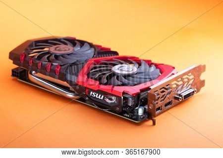 Belgorod , Russia - MAY, 6, 2020: MSI 1050ti Game graphics video card isolated on orange background.