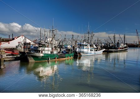 Fishing Boats In Marina And A Cloudy Sky. This Marina Is Located In The Stevestone Area Of Richmond.