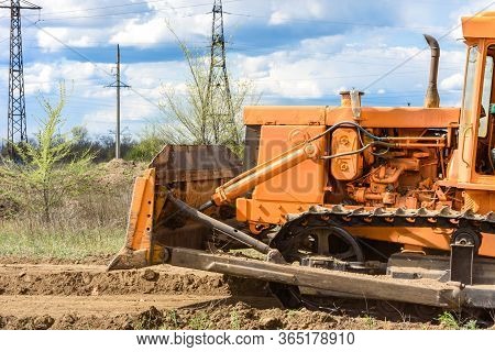 Industrial Building Construction Site Bulldozer Leveling And Moving Soil During Highway Building. Ye
