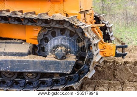 Industrial Building Construction Site Bulldozer Leveling And Moving Soil During Highway Building. Ye