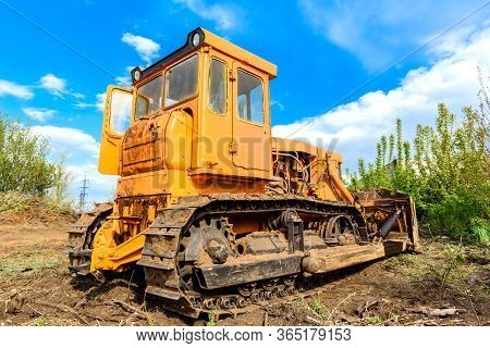 Industrial Building Construction Site Bulldozer Leveling And Moving Soil During Highway Building