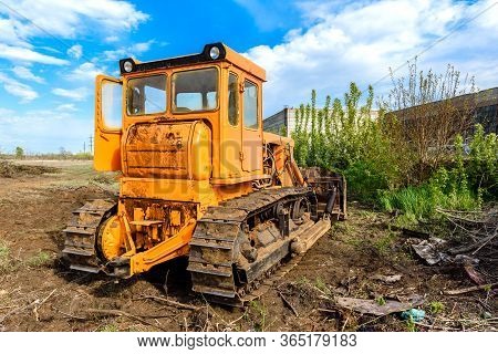Industrial Building Construction Site Bulldozer Leveling And Moving Soil During Highway Building. Ye