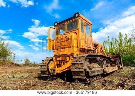 Industrial Building Construction Site Bulldozer Leveling And Moving Soil During Highway Building. Ye