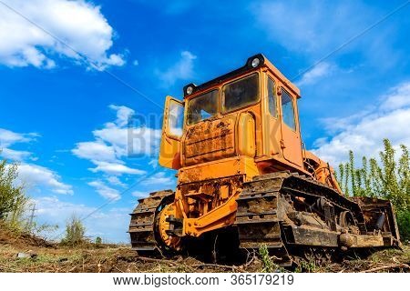Industrial Building Construction Site Bulldozer Leveling And Moving Soil During Highway Building. Ye