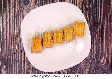 Traditional Arabic/turkish Sweets With Walnuts - Baklava With Walnuts On A Plate. Top View