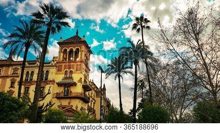 Seville, Spain - 10 February 2020 : Architecture With Palm Trees In Beautiful Seville Spain City Cen
