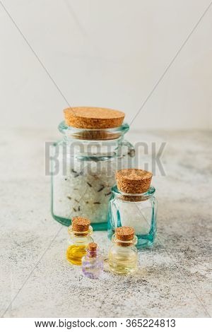 Aromatic Oils In Glass Bottles, Aromatic Salts And Dry Lavender. Concept Natural Ogranic Skincare Co