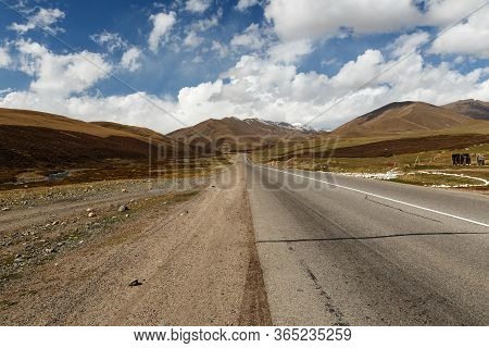 Asphalt Road M41, Bishkek Osh Highway In Suusamyr Valley Of Kyrgyzstan.