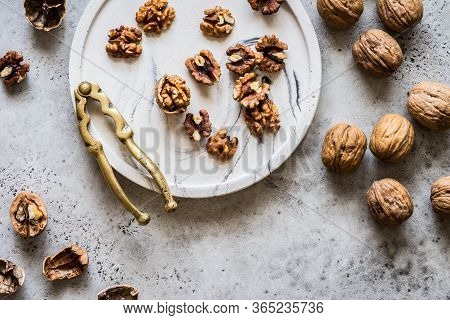Cracking Walnuts With A Brass Nut Cracker