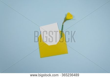 Minimalistic Composition With A Beautiful Festive Yellow Mustard Envelope, White Blank Card And Narc