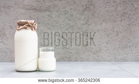 Fresh Milk In A Bottle On Grey Background. Kefir, Milk Or Turkish Ayran Drink. World Milk Day Concep