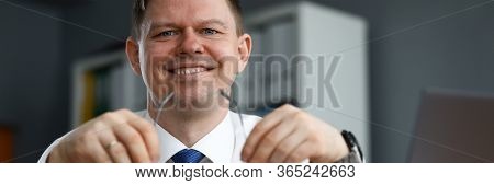 Man Business Clothes Sitting At Table And Smiling. Happy Man Working At Home In Self-isolation. Impl