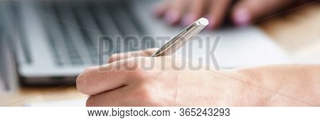 Man At Home Makes Notes In Report Near Laptop. Advising Specialist In Personnel Matters. Services Fo