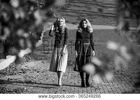 Time To Relax. Girls In Corrugated Skirt And Sweater. Female Beauty. Real Femininity. Autumn Women O