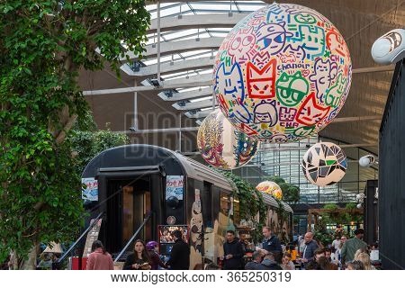 Paris, France - April 15, 2019 : People Near A Decorated Train Car In La Felicita Italian Bar-restau