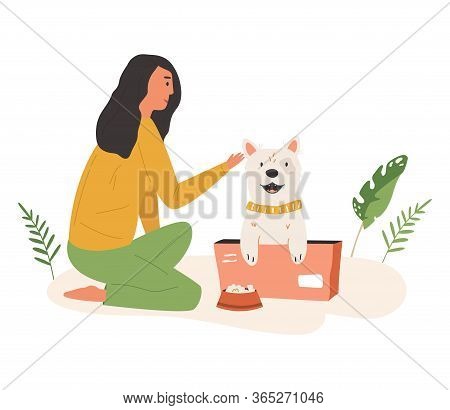 Young Cute Volunteer Girl Feeding Street Dog