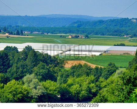 Large Area Of The Dordogne Valley, Covered In Polytunnels, Seen From The Village Of Limeuil