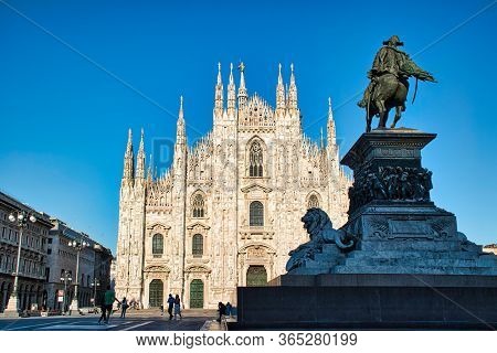 Milan, Italy May 8, 2020: The Golden Sunshine Is Reflecting On The Front Of The Magnificent Duomo Di