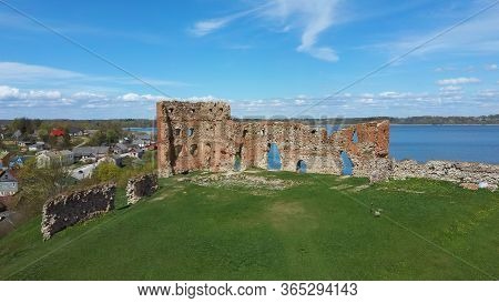 Aerial View Of The Ludza Medieval Castle Ruins On A Hill Between Big Ludza Lake And Small Ludza Lake