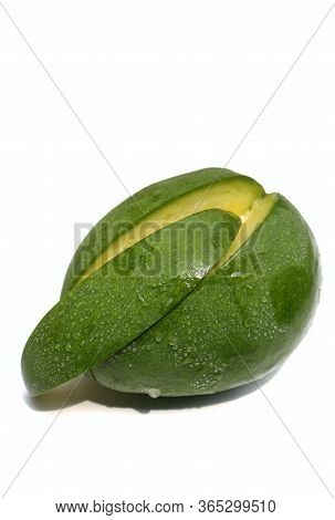 Closeup Of Raw Mango With Water Drops Isolated On White Background