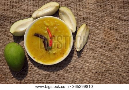 Mango Chutney Cuisine In Plate With Raw Mango On Burlap Background With Copy Space