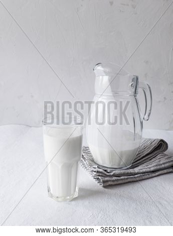Glass Of Milk With Ear Of Wheat On Grey Rusty Metal Background, Copy Space