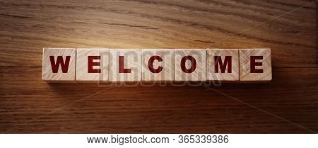 Wooden Blocks With The Text Welcome. Congradulation Newcomers Concept