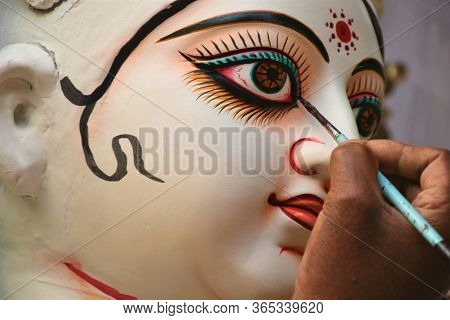 An Artist Drawing Eyes Of Goddess Durga ; Kumartuli ; Calcutta Kolkata ; West Bengal ; India