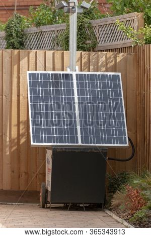 Bristol-may-2020-england-a Close Up View Of A Portable Solar Pannel Charger Outside A Hotel On A Mai